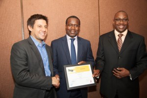 Sanergy Co-Founder David Auerbach (left) receives an award from  Acumen East Africa Duncan Onyango (centre) and SAP East Africa MD Andrew  Waititu