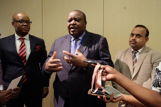  CEO Tanzanian Private Sector Foundation gives a statement to members of the press, flanked by the country director, Sproxil Tanzania (L), and regional director, Sproxil Africa (R) 
